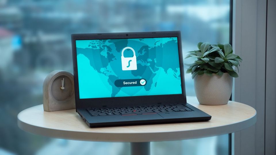Business laptop showing a secured connection, representing small business cybersecurity