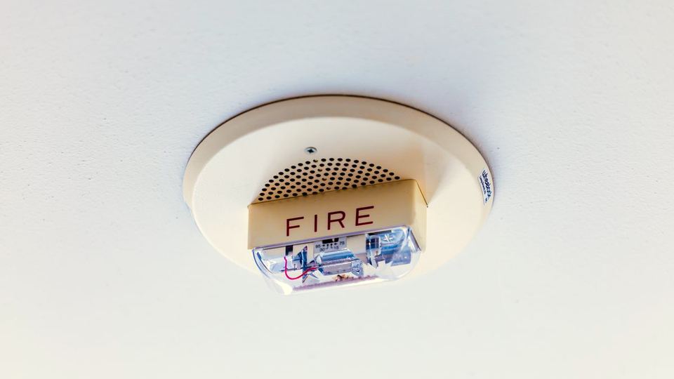 Commercial fire alarm horn strobe installed on a ceiling