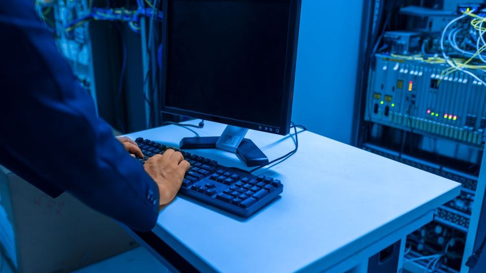 IT technician providing managed IT support in a server room